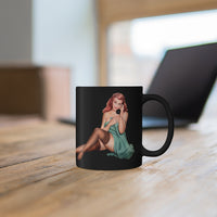 Red Hair Pin-up Girl On Black Coffee Mug In Front Of A Laptop